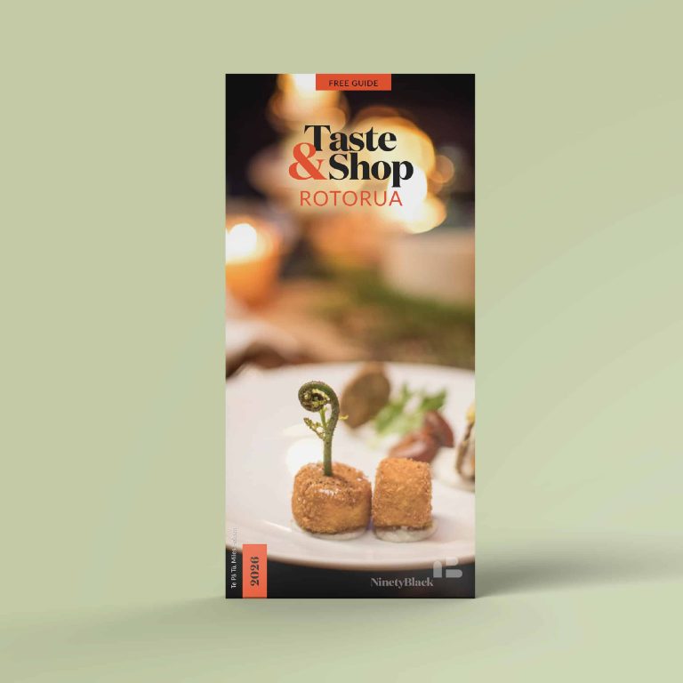 Cover of the Taste & Shop Rotorua guide showing a fine-dining plate with crispy bites and a pikopiko fern.